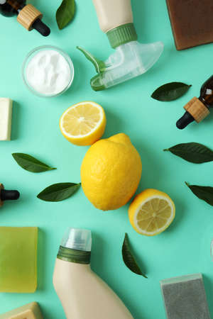 Cleaning concept with eco friendly cleaning tools and lemons on mint backgroundの写真素材