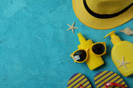 Summer concept with sunscreen on blue textured backgroundの写真素材