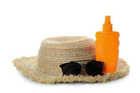 Sunscreen, sunglasses and straw hat isolated on white backgroundの写真素材