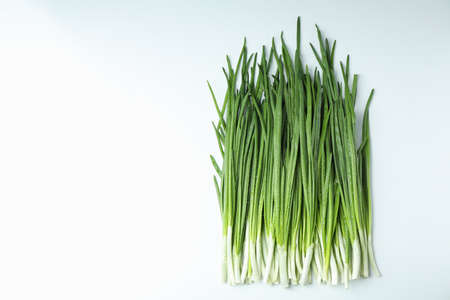 Fresh green onion with water drops on white backgroundの写真素材