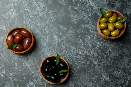 Bowls with olives on black smokey backgroundの写真素材