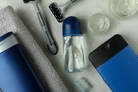 Concept of men's hygiene tools on white textured table