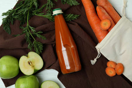 Bottle of apple - carrot juice and ingredients, top viewの写真素材