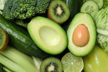 Fresh green vegetables on whole background, close up