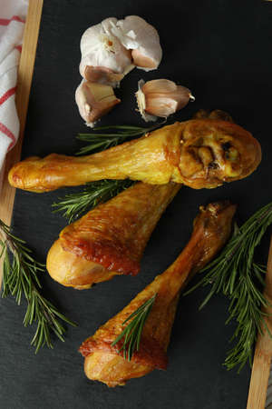 Board with roast chicken drumsticks, top viewの写真素材