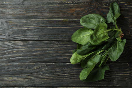 Fresh raw spinach on rustic wooden backgroundの写真素材