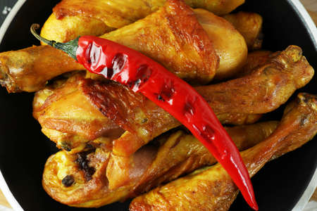 Pan of roast chicken drumsticks, close upの写真素材