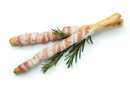 Grissini sticks with bacon isolated on white backgroundの写真素材