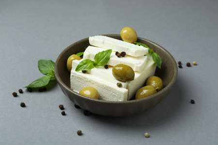 Bowl with feta cheese and spices on gray backgroundの写真素材