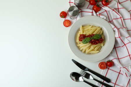 Concept of tasty food with pasta with tomato sauce on white backgroundの写真素材