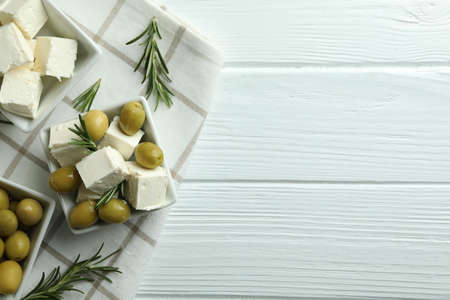 Concept of tasty food with feta cheese on white wooden backgroundの写真素材