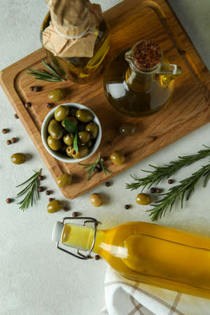 Concept of tasty eating with olive oil on white textured backgroundの写真素材