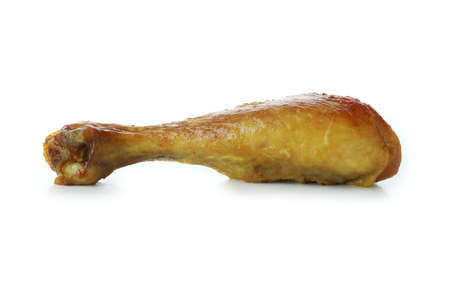 Roast chicken drumstick isolated on white backgroundの写真素材