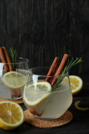 Glasses of lemonade on wooden background, space for textの写真素材