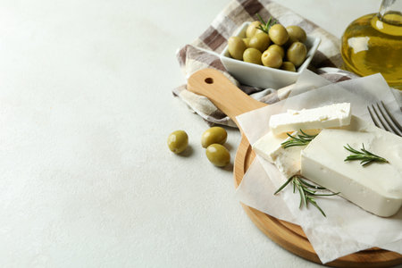Concept of tasty food with feta cheese on white textured backgroundの写真素材