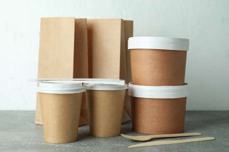 Delivery containers for takeaway food on gray textured tableの写真素材