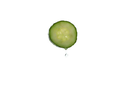 Cucumber slice with water drop isolated on white backgroundの写真素材