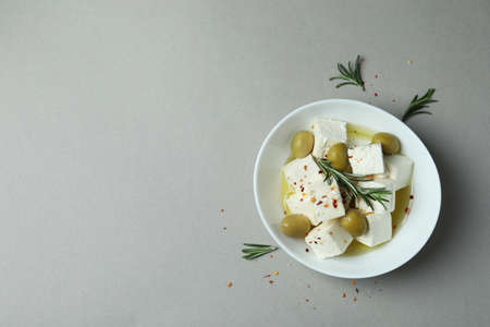Bowl with feta cheese and spices on gray backgroundの写真素材