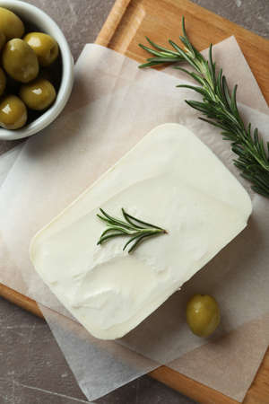 Concept of tasty food with feta cheese on gray textured background