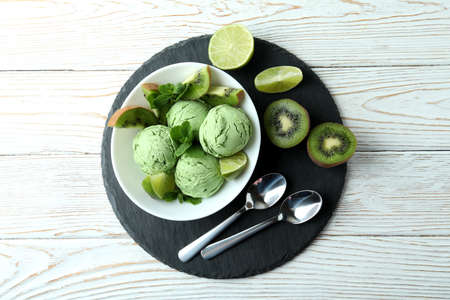 Tray with mint ice cream on white wooden backgroundの写真素材
