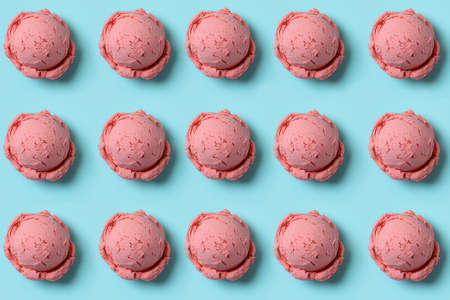 Strawberry ice cream balls on blue backgroundの写真素材