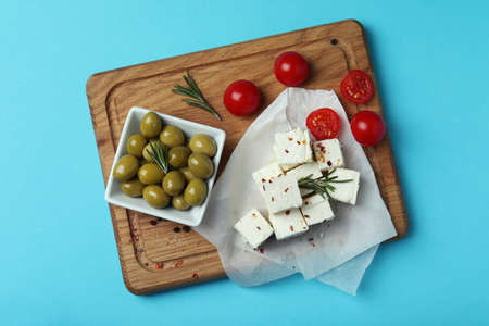 Concept of tasty food with feta cheese on blue backgroundの写真素材