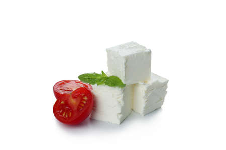 Feta cheese pieces isolated on white backgroundの写真素材