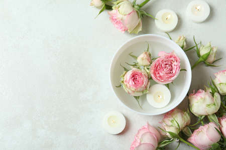 Romantic concept with roses on white textured tableの写真素材