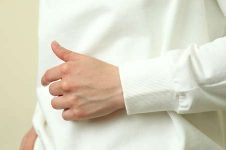 Young woman in white sweatshirt, close up