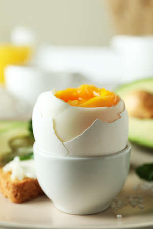 Concept of tasty breakfast with boiled egg, close up