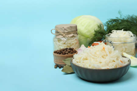 Fresh sauerkraut and ingredients on blue backgroundの写真素材