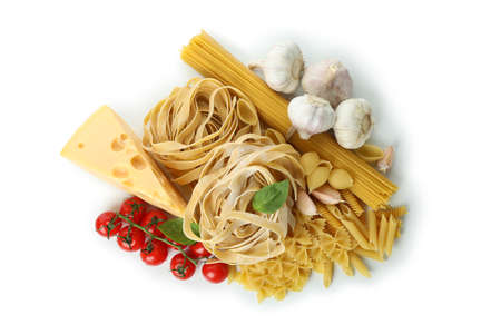 Uncooked pasta and ingredients isolated on white backgroundの写真素材