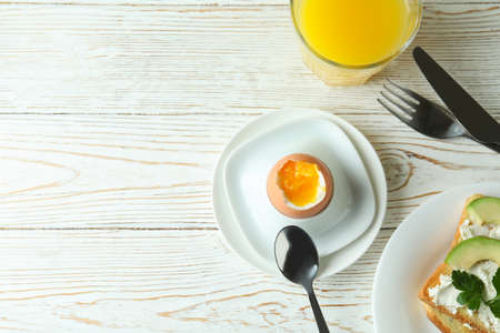 Concept of tasty breakfast with boiled egg, space for text