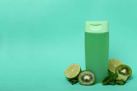 Shower gel and ingredients on mint backgroundの写真素材