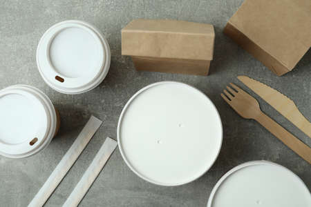 Delivery containers for takeaway food on gray textured tableの写真素材