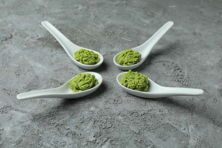 Ceramic spoons with wasabi on gray textured backgroundの写真素材