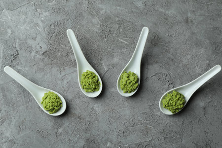 Ceramic spoons with wasabi on gray textured backgroundの写真素材