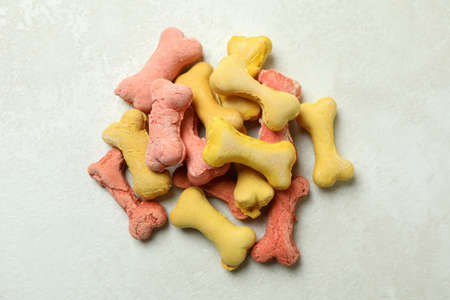 Pile of dog feed on white textured background