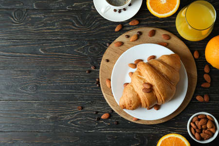 Concept of tasty breakfast with growing on wooden background