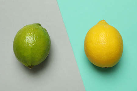 Lemon and lime on two tone background, close upの写真素材