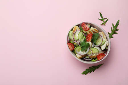 Salad with grilled chicken on pink backgroundの写真素材