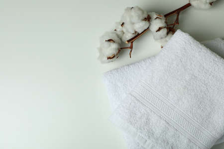 Clean folded towels and cotton on white backgroundの写真素材