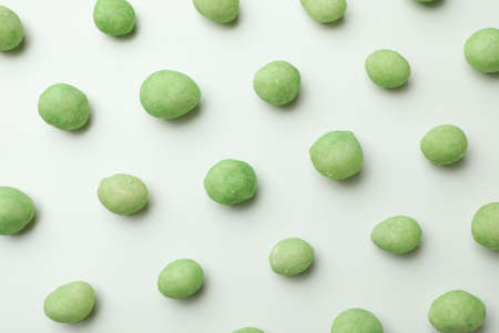 Flat lay with wasabi nuts on white backgroundの写真素材