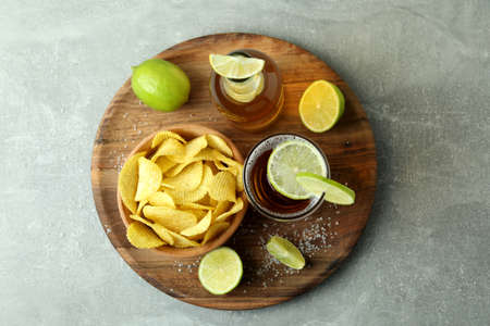 Beer with snacks on gray textured backgroundの写真素材