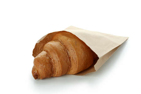 Paper bag with croissant isolated on white backgroundの写真素材