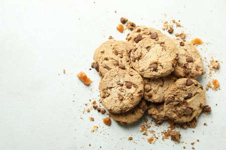 Cookies with caramel on white textured background