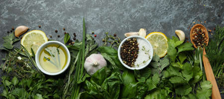Fresh herbs on black smokey background, top viewの写真素材