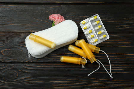 Concept of menstruation on wooden background, top viewの写真素材
