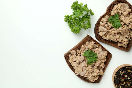 Concept of tasty eating with canned tuna on white background