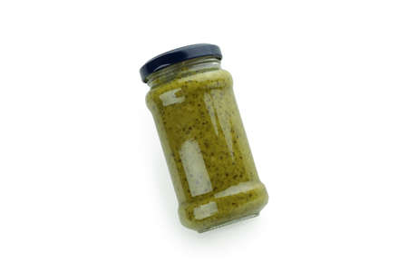 Jar of Pesto sauce isolated on white background